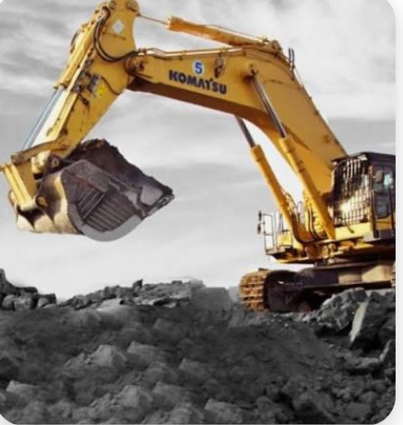 Mining excavator loading raw ore at an open-cast site